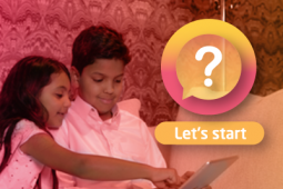 Two young siblings entertaining with a tablet 