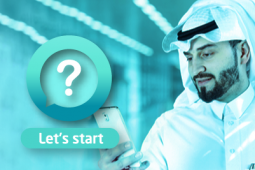 A Qatari man looking at his phone